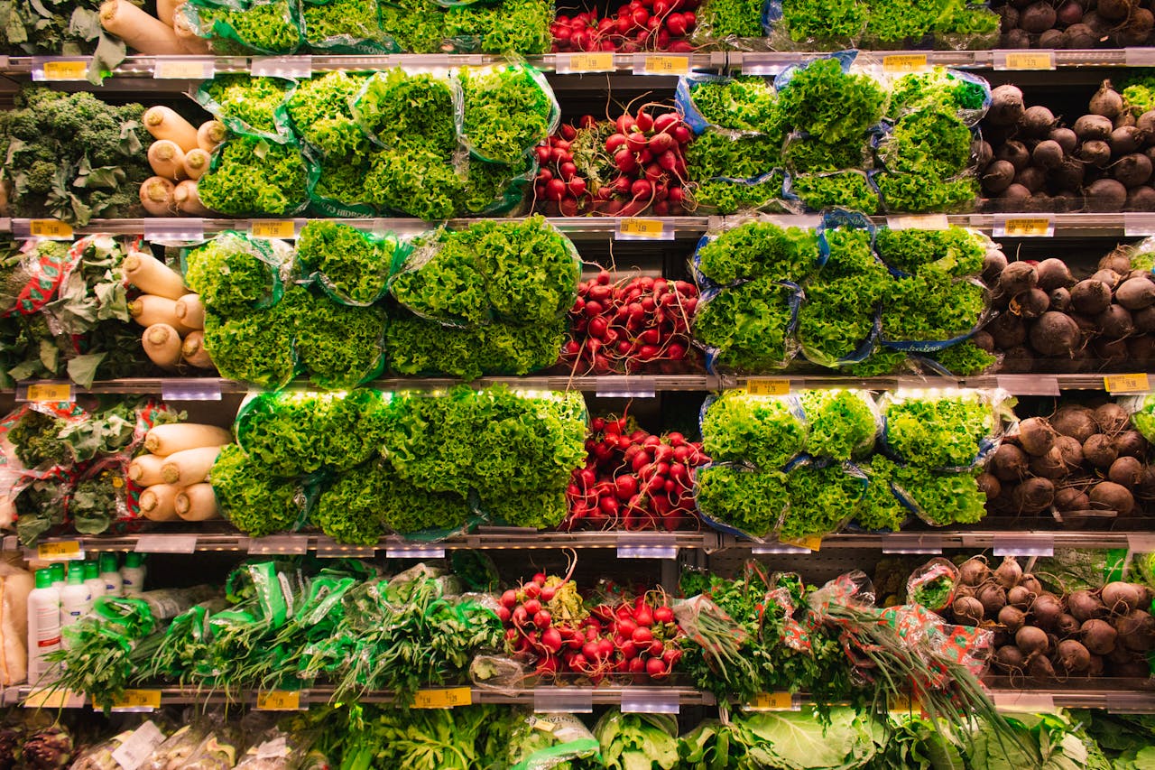 portfolio-06 Colorful assortment of fresh vegetables arranged on supermarket shelves, perfect for healthy eating themes.